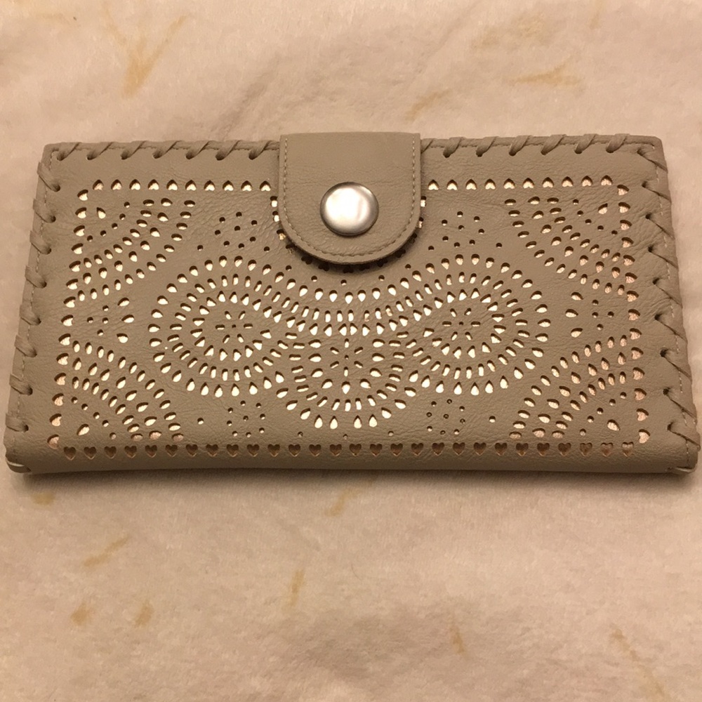 Laser cut tan clutch bag by expressions nyc